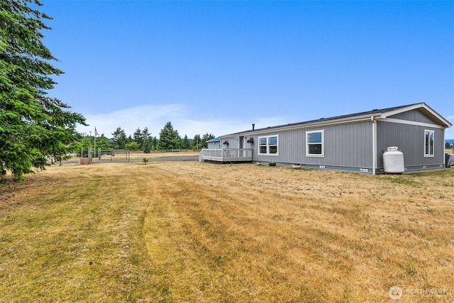 8222 Bordeaux Rd SW, Olympia, WA 98512 - view of grassy yard featuring a wooden deck