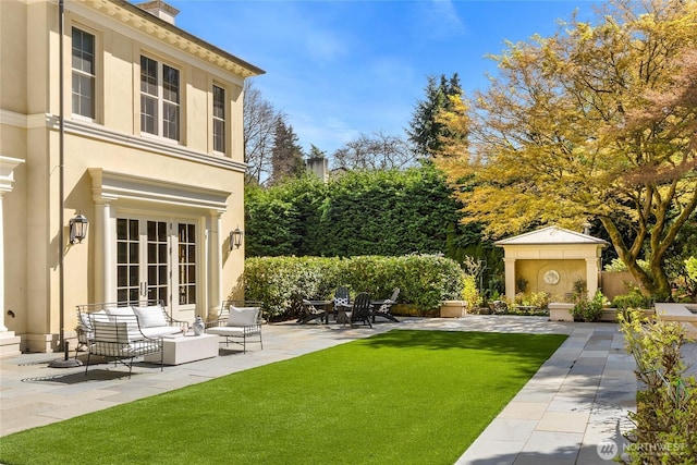 2001 Broadmoor Dr E, Seattle, WA 98112 - view of green lawn with french doors, a patio area, and an outdoor living space
