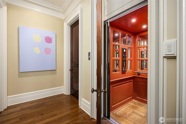 2001 Broadmoor Dr E, Seattle, WA 98112 - wine area featuring ornamental molding, elevator, and wood finished floors