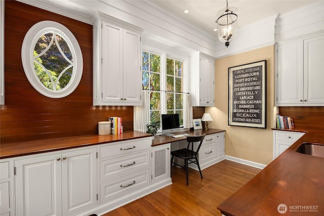 2001 Broadmoor Dr E, Seattle, WA 98112 - home office featuring built in desk, wood finished floors, and recessed lighting