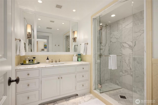 2001 Broadmoor Dr E, Seattle, WA 98112 - full bath with a marble finish shower, marble finish flooring, recessed lighting, and vanity