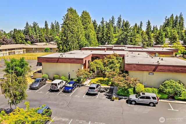 502 141st Ave SE Unit 45, Bellevue, WA 98007 - view of building exterior with uncovered parking