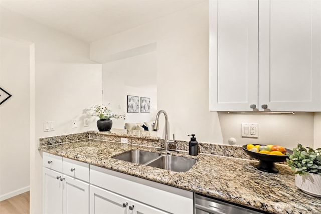 502 141st Ave SE Unit 45, Bellevue, WA 98007 - kitchen featuring light stone countertops, white cabinets, light wood finished floors, and dishwasher