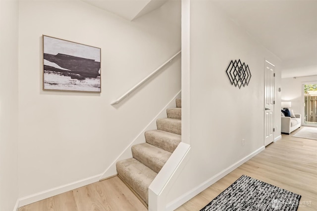 502 141st Ave SE Unit 45, Bellevue, WA 98007 - stairway with wood finished floors and baseboards