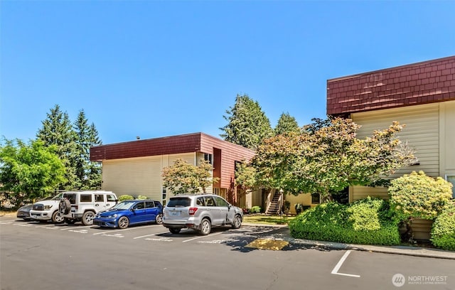 502 141st Ave SE Unit 45, Bellevue, WA 98007 - view of building exterior with uncovered parking and stairs