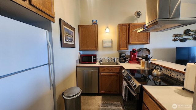 835 Ocean Shores Blvd NW Unit 305, Ocean Shores, WA 98569 - kitchen featuring freestanding refrigerator, dishwasher, black range with electric cooktop, wall chimney range hood, and brown cabinets