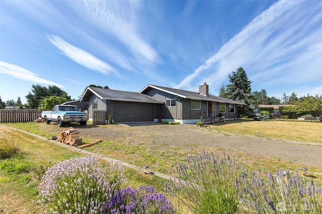 110 Victoria View St, Sequim, WA 98382 - view of front of property with an attached garage, dirt driveway, and a chimney