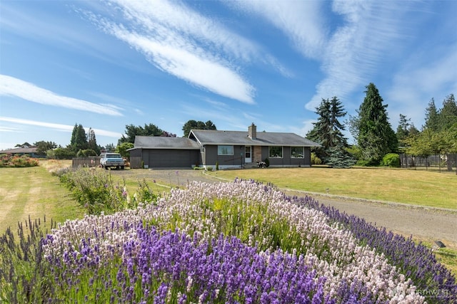 110 Victoria View St, Sequim, WA 98382 - ranch-style home featuring an attached garage, driveway, a chimney, and a front yard