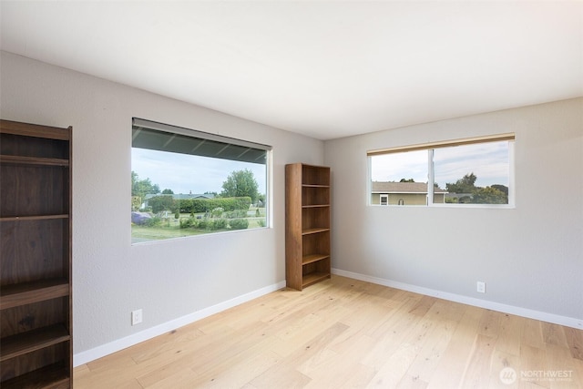 110 Victoria View St, Sequim, WA 98382 - empty room featuring wood finished floors and baseboards