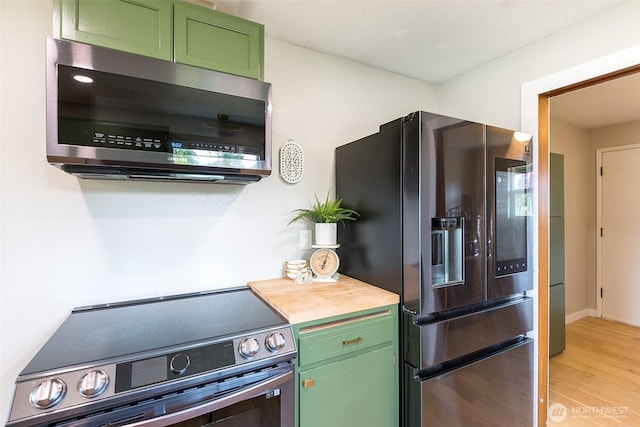 110 Victoria View St, Sequim, WA 98382 - kitchen with stainless steel appliances, green cabinetry, and light wood-type flooring