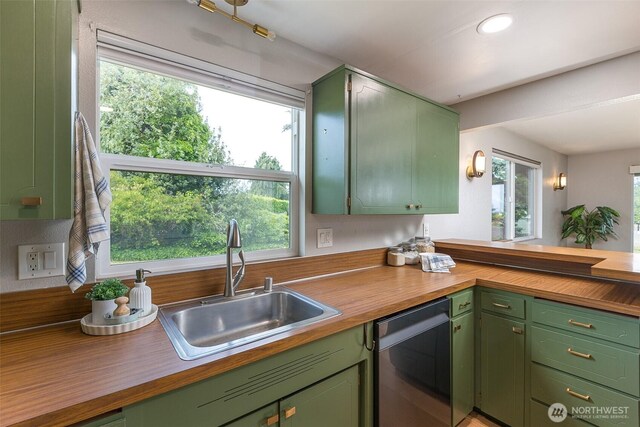110 Victoria View St, Sequim, WA 98382 - kitchen featuring stainless steel dishwasher, green cabinetry, wood counters, a peninsula, and recessed lighting
