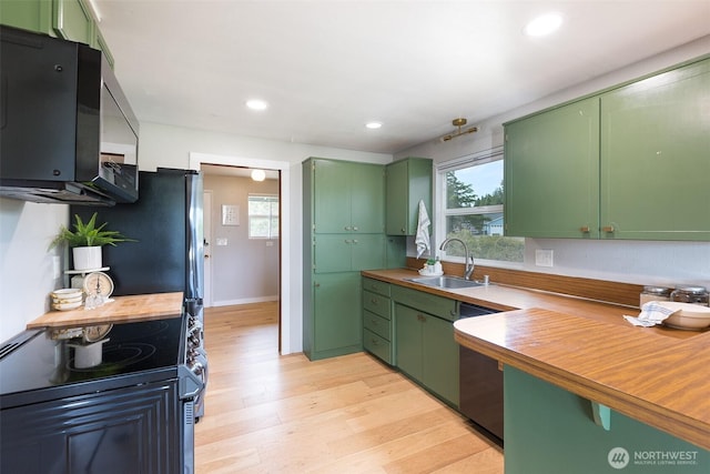110 Victoria View St, Sequim, WA 98382 - kitchen with green cabinets, range with electric stovetop, dishwasher, light wood-type flooring, and recessed lighting