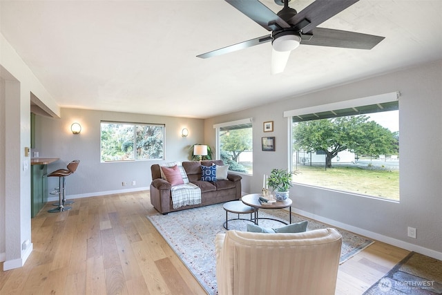 110 Victoria View St, Sequim, WA 98382 - living area featuring wood-type flooring, healthy amount of natural light, and ceiling fan