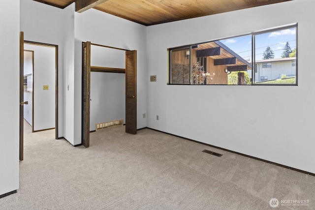 21030 6th Ave S, Des Moines, WA 98198 - unfurnished bedroom with wooden ceiling, carpet floors, and a closet