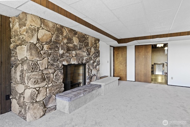 21030 6th Ave S, Des Moines, WA 98198 - unfurnished living room with carpet, a fireplace, and a drop ceiling