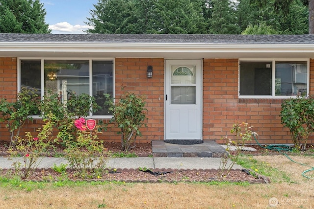 2598 25th Loop SE, Lacey, WA 98503 - view of exterior entry with brick siding and a shingled roof