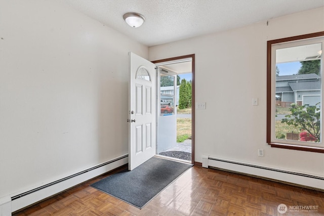 2598 25th Loop SE, Lacey, WA 98503 - foyer entrance with baseboard heating, plenty of natural light, and a textured ceiling