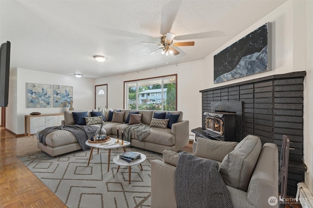 2598 25th Loop SE, Lacey, WA 98503 - living area with a textured ceiling, ceiling fan, and a baseboard heating unit