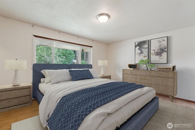 2598 25th Loop SE, Lacey, WA 98503 - bedroom featuring light wood-style floors and a textured ceiling