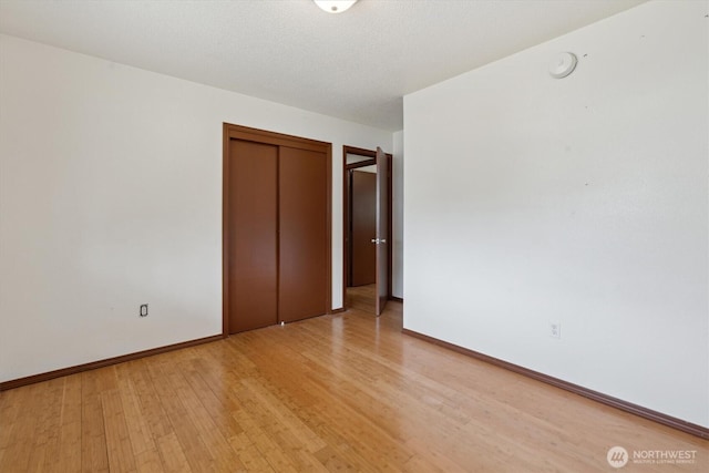 2598 25th Loop SE, Lacey, WA 98503 - unfurnished bedroom with light wood-type flooring and a closet