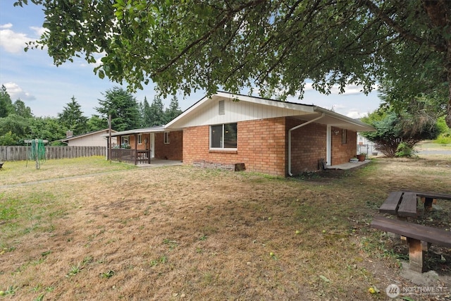 2598 25th Loop SE, Lacey, WA 98503 - view of home's exterior with brick siding and a patio