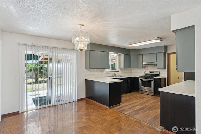 2598 25th Loop SE, Lacey, WA 98503 - kitchen featuring stainless steel range with gas cooktop, a chandelier, a textured ceiling, plenty of natural light, and light countertops