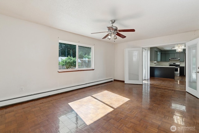 2598 25th Loop SE, Lacey, WA 98503 - unfurnished room featuring a baseboard radiator, a chandelier, and a ceiling fan