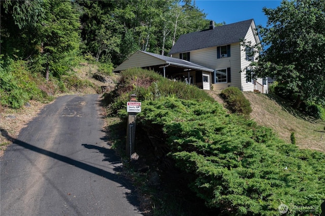 1608 Laura St, Aberdeen, WA 98520 - view of front of house featuring asphalt driveway and a chimney