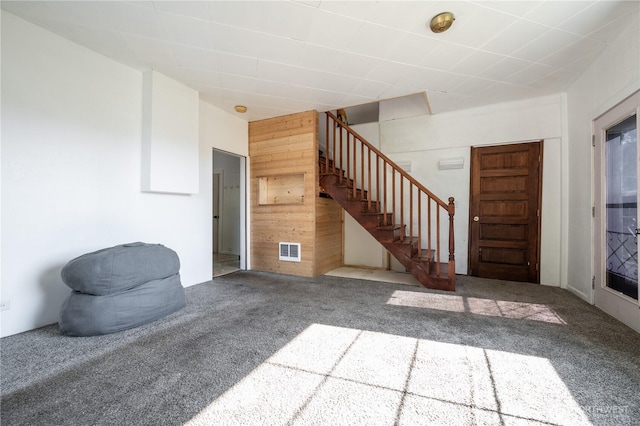 1608 Laura St, Aberdeen, WA 98520 - foyer entrance featuring carpet floors, stairs, and wood walls