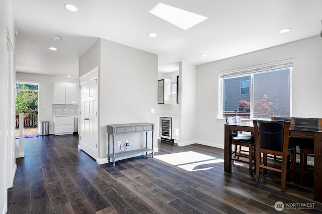 1326 SW 340th St, Federal Way, WA 98023 - dining area with wine cooler, dark wood-style floors, a skylight, and recessed lighting