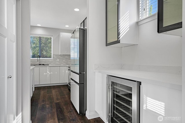 1326 SW 340th St, Federal Way, WA 98023 - bar area featuring wine cooler, dark wood-style flooring, decorative backsplash, refrigerator, and recessed lighting