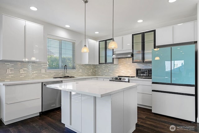 1326 SW 340th St, Federal Way, WA 98023 - kitchen featuring appliances with stainless steel finishes, exhaust hood, dark wood finished floors, white cabinets, and glass insert cabinets