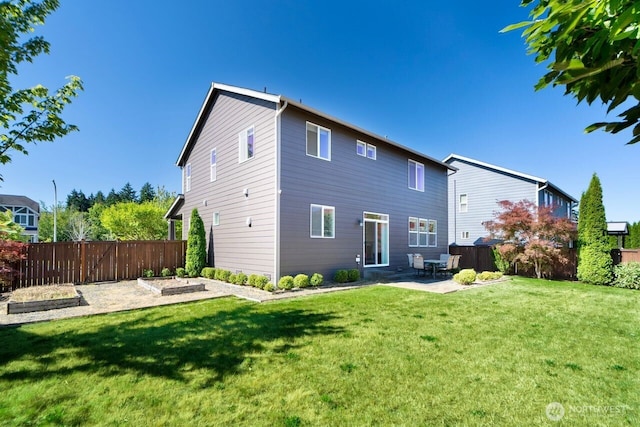 1326 SW 340th St, Federal Way, WA 98023 - back of house with a vegetable garden and a patio area