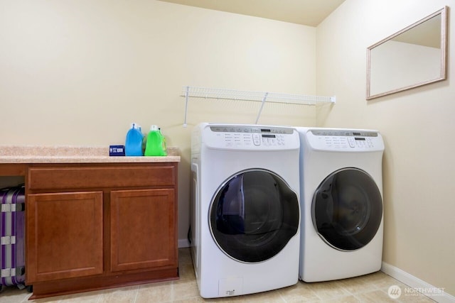 1326 SW 340th St, Federal Way, WA 98023 - washroom featuring washer and dryer and cabinet space