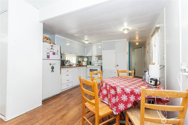 5920 200th St SW Unit 37, Lynnwood, WA 98038 - dining space with light wood-style flooring and healthy amount of natural light