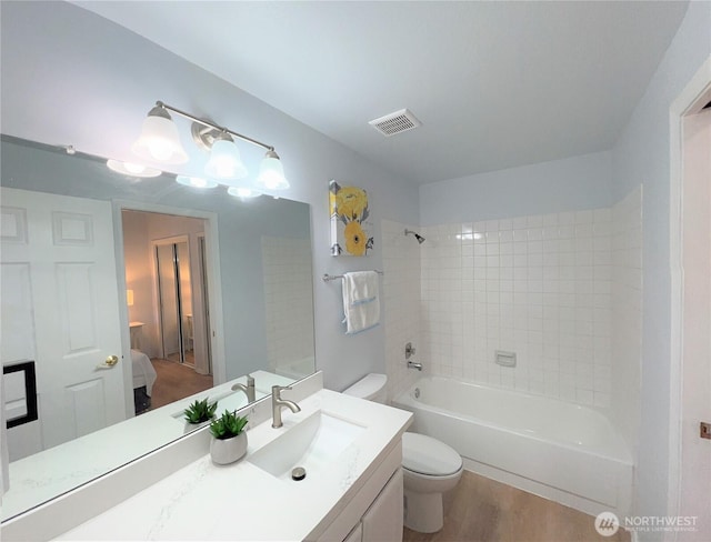 1711 159th Pl NE Unit 29, Bellevue, WA 98008 - ensuite bathroom featuring vanity, wood finished floors, and  shower combination