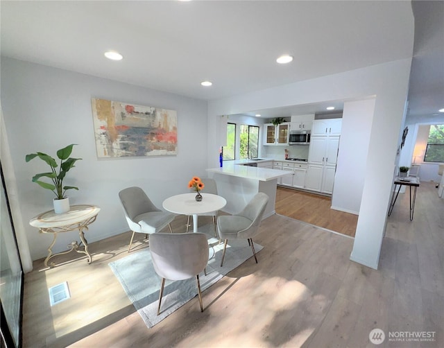 1711 159th Pl NE Unit 29, Bellevue, WA 98008 - dining area featuring light wood-type flooring and recessed lighting