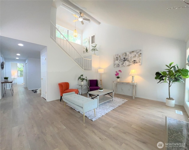 1711 159th Pl NE Unit 29, Bellevue, WA 98008 - sitting room featuring stairs, high vaulted ceiling, wood finished floors, ceiling fan, and beamed ceiling