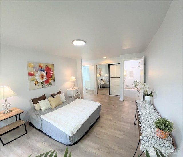 1711 159th Pl NE Unit 29, Bellevue, WA 98008 - bedroom featuring light wood-style flooring and a closet