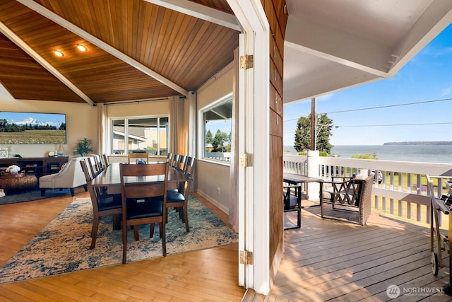 6926 Holeman Ave, Blaine, WA 98230 - dining area featuring hardwood / wood-style flooring, a water view, and wooden ceiling