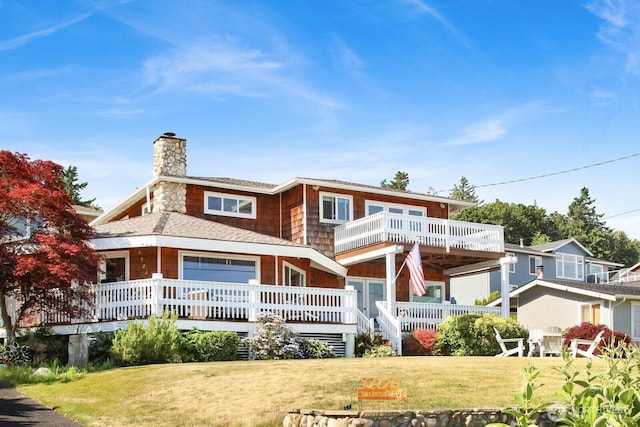 6926 Holeman Ave, Blaine, WA 98230 - back of house featuring a chimney, a yard, and a balcony