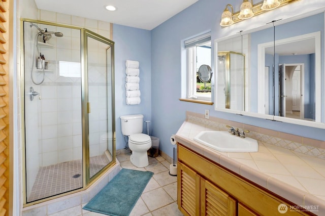 6926 Holeman Ave, Blaine, WA 98230 - bathroom with vanity, a shower stall, tile patterned floors, and recessed lighting