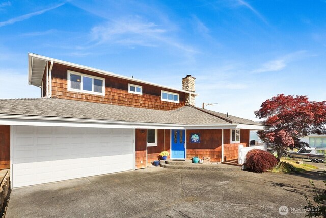 6926 Holeman Ave, Blaine, WA 98230 - view of front of property featuring a chimney, concrete driveway, and a shingled roof
