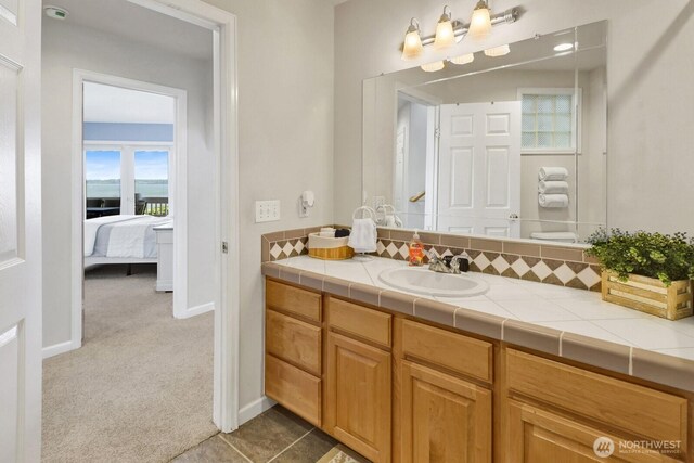 6926 Holeman Ave, Blaine, WA 98230 - ensuite bathroom with vanity and baseboards