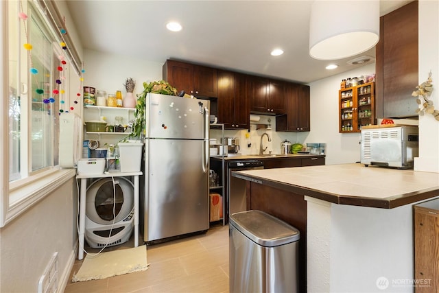 7343 35th SW, Seattle, WA 98126 - kitchen featuring stainless steel appliances, dark brown cabinets, tile counters, washer / dryer, and recessed lighting