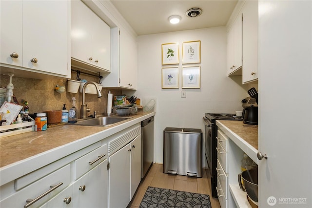 7343 35th SW, Seattle, WA 98126 - kitchen featuring decorative backsplash, white cabinets, dishwasher, light countertops, and stove