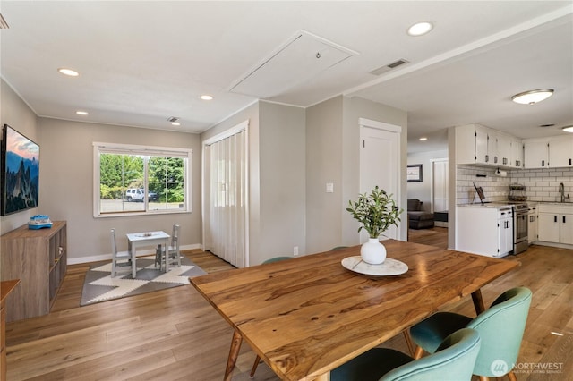 4502 223rd St SW, Mountlake Terrace, WA 98043 - dining area featuring attic access, light wood-style floors, and recessed lighting