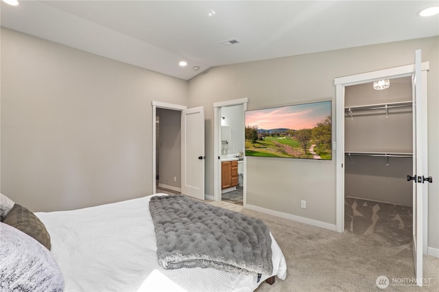 4502 223rd St SW, Mountlake Terrace, WA 98043 - bedroom with a walk in closet, light colored carpet, recessed lighting, vaulted ceiling, and connected bathroom