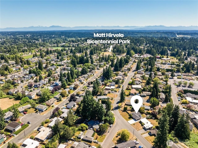 4502 223rd St SW, Mountlake Terrace, WA 98043 - aerial perspective of suburban area with a mountainous background and a forest