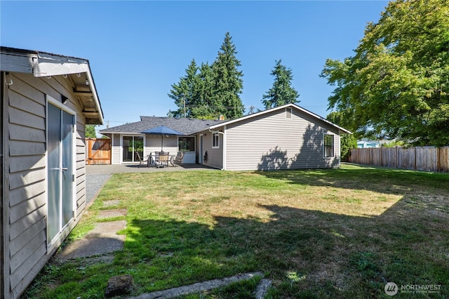 4502 223rd St SW, Mountlake Terrace, WA 98043 - back of house featuring a fenced backyard and a patio